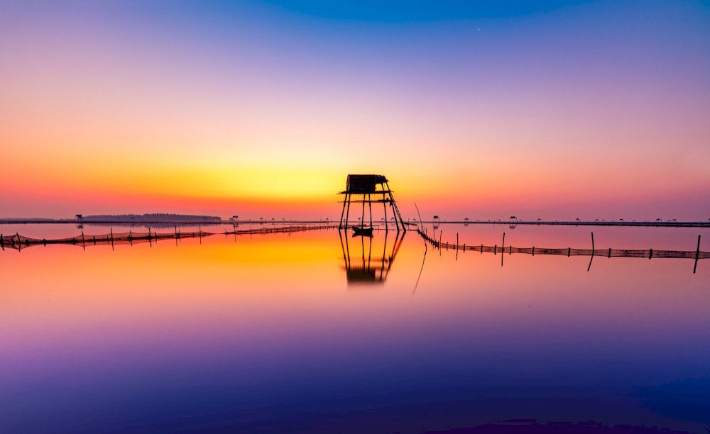 Picturesque sunrise over the sea at Dong Chau Beach